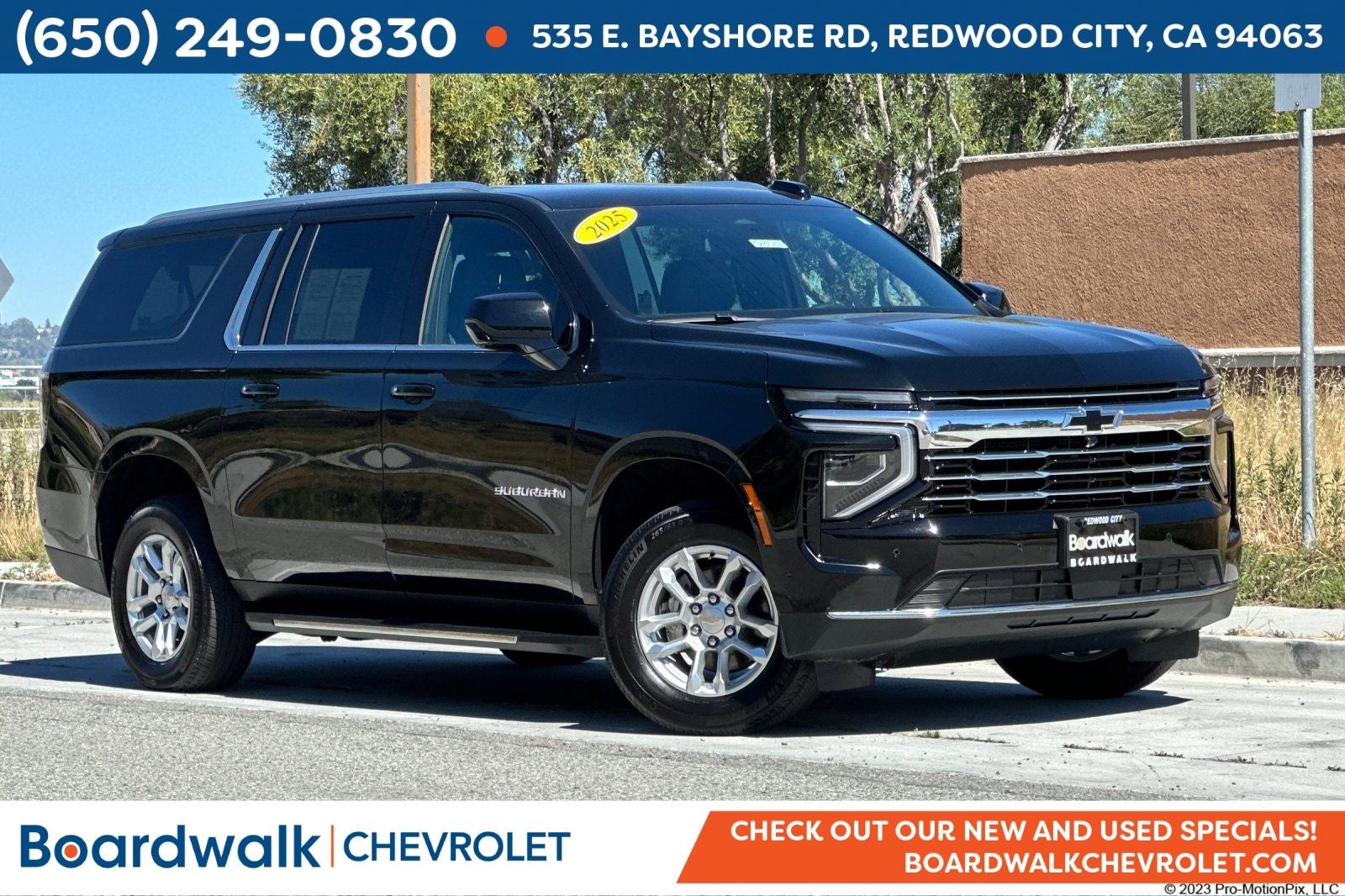 2025 Chevrolet Suburban 4WD LT in Black — front three-quarter view